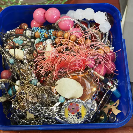 plastic tub of costume jewellery