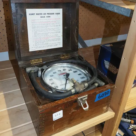 vintage air pressure gauge in wooden box