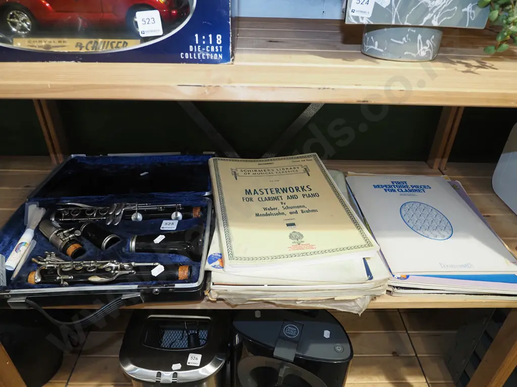 cased clarinet and sheet music Image 1++