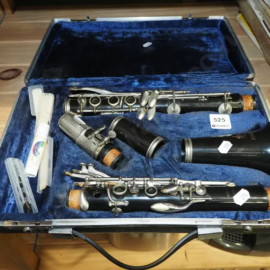 cased clarinet and sheet music
