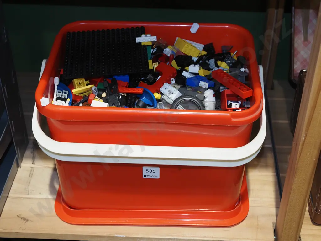 red plastic tub of Lego and Toro blocks Image 1++