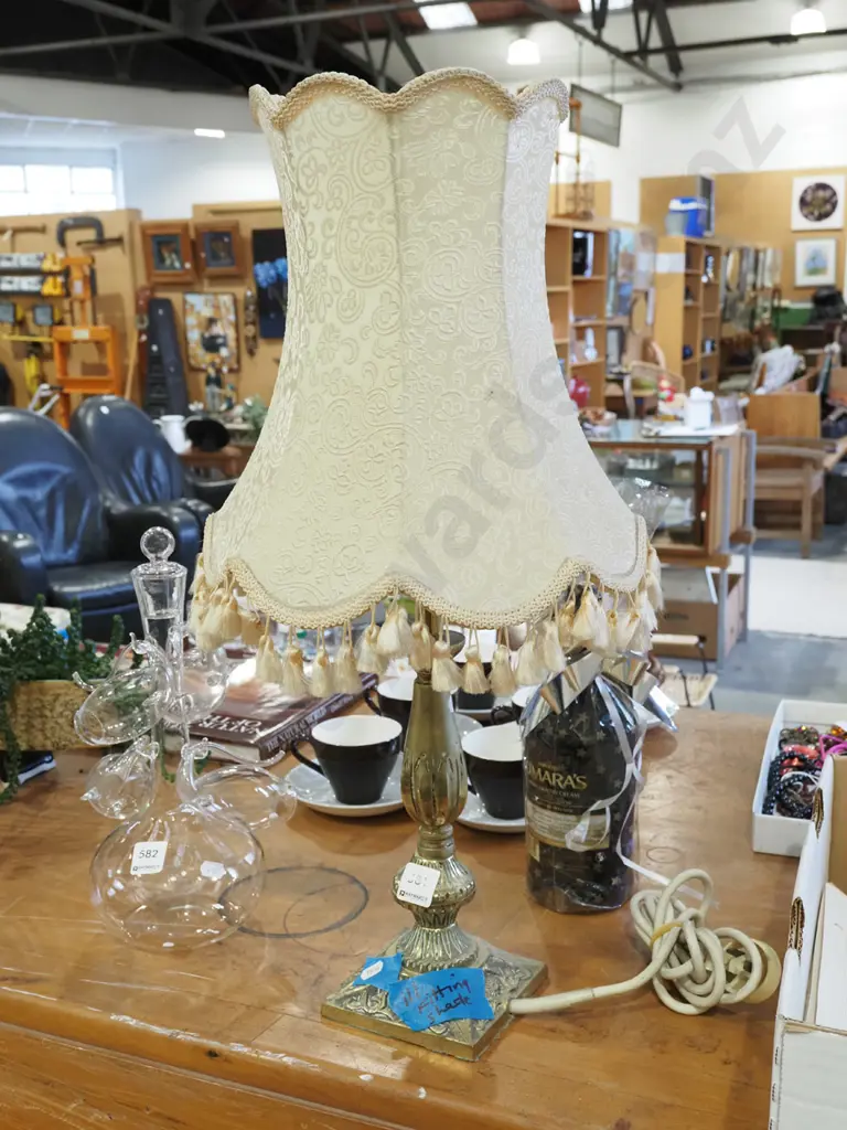 brass based table lamp with ill fitting shade Image 1++