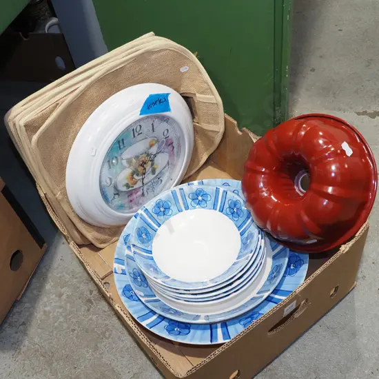box; placemats, wall clock, cake moulds, blue and white bowls