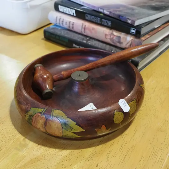 wooden nut bowl and hammer