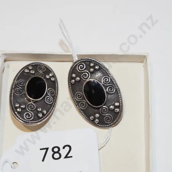 pair of sterling silver and black stone decorative earrings