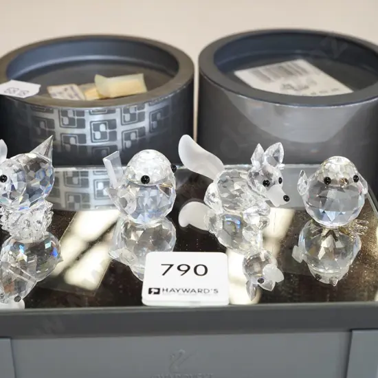 4x boxed Swarovski crystal miniature animals on mirrored glass stand