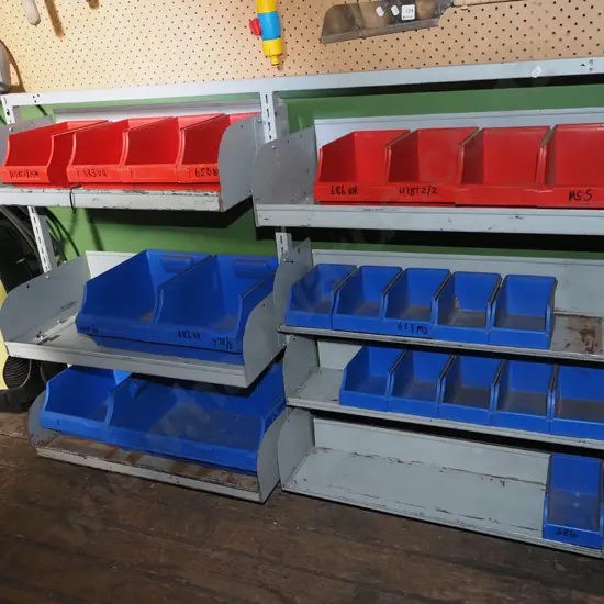 mounted louvered panel and shelf storage rack with red and blue bins H900 W1340