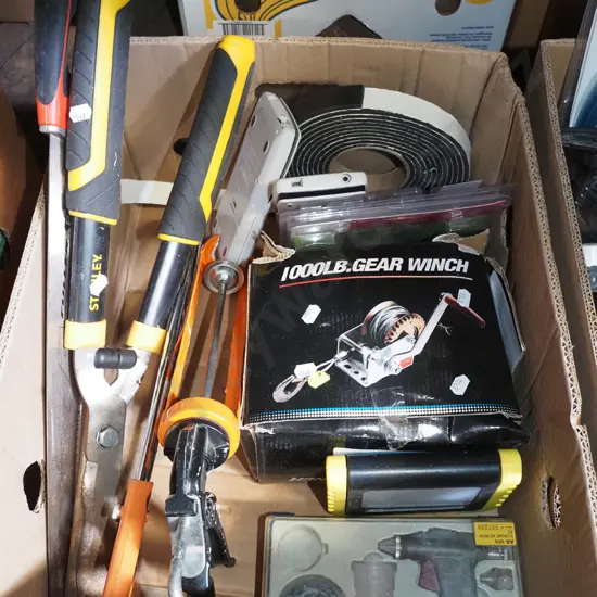 box; hand operated winch, caulking gun, calculators etc