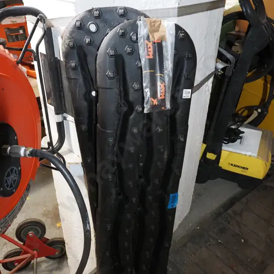 pair of black plastic off road recovery tracks