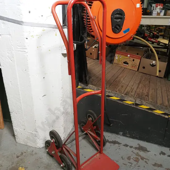 red metal stair climbing hand truck