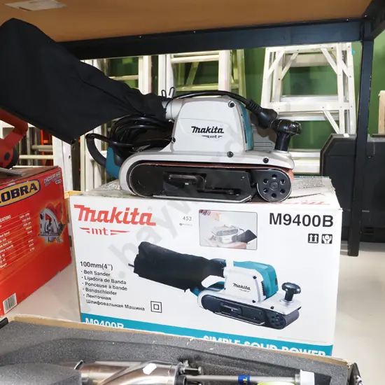 as new boxed Makita M9400B belt sander