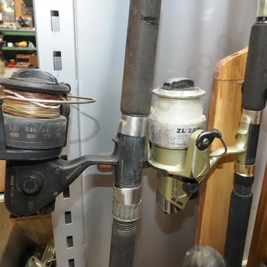 2x fishing rods and reels - orange dots