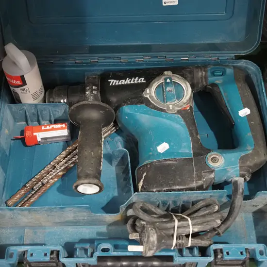 cased Makita impact drill with additional bits