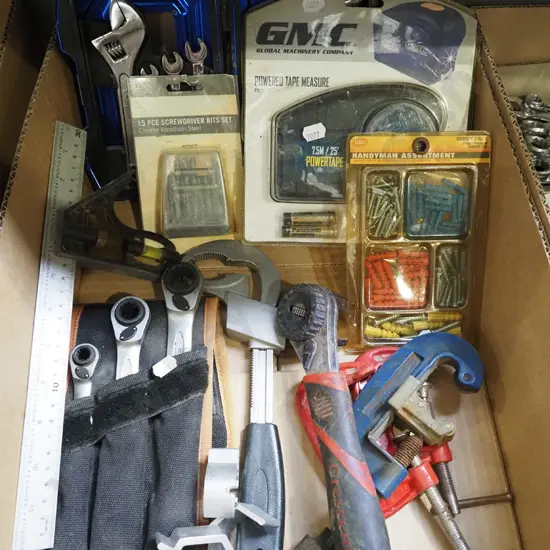 box; powered tape measure, pipe cutter, builder's square etc