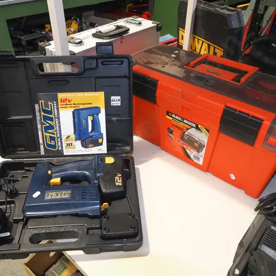 cased GMC 12V cordless nailer, orange plastic Black and Decker tool box