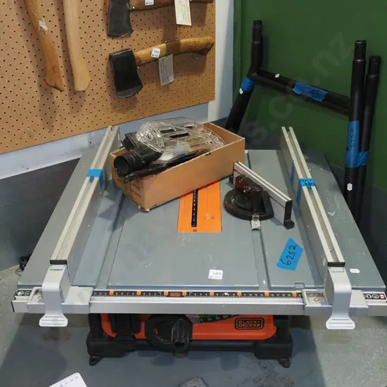 Black and Decker table saw - has box of accessories and legs