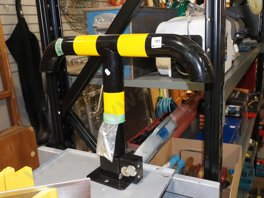 small black and yellow drop down bollard H410 - key in office Image 1++