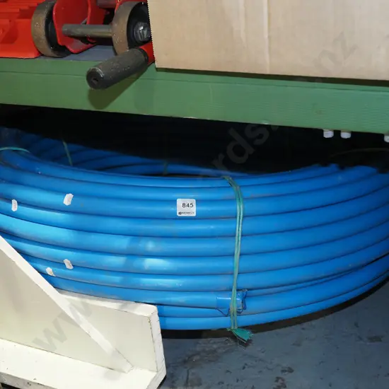 large roll of blue alkythene irrigation pipe
