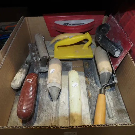 box of various concreting and plastering floats