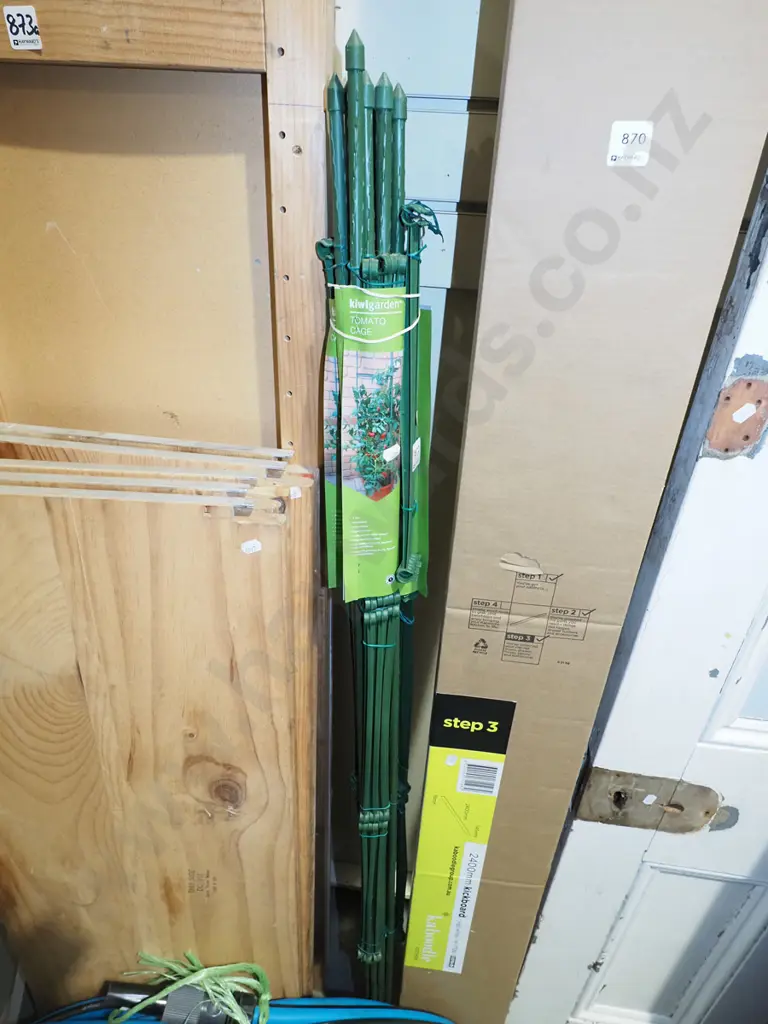 bundle of green plastic tomato cages Image 1++