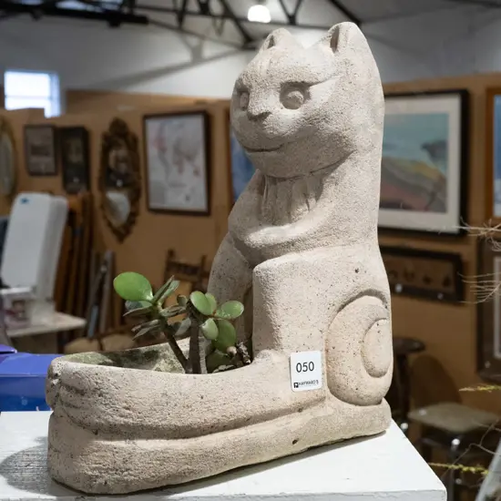 carved Oamaru stone cat themed garden planter H300