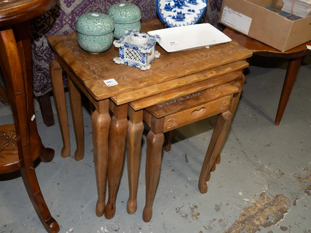 nest of 4 carved hardwood tables Image 1++