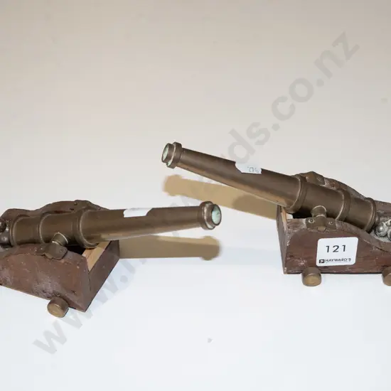 2x small brass canons L180