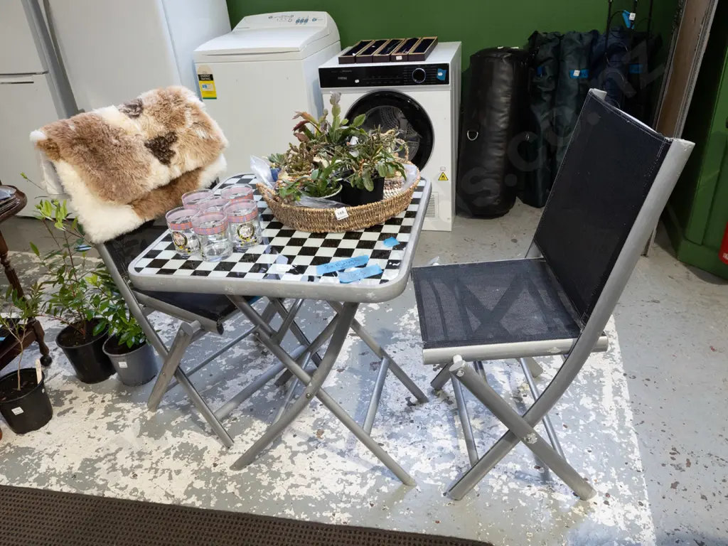 black and white checked glass top outdoor table with 2 chairs Image 1++