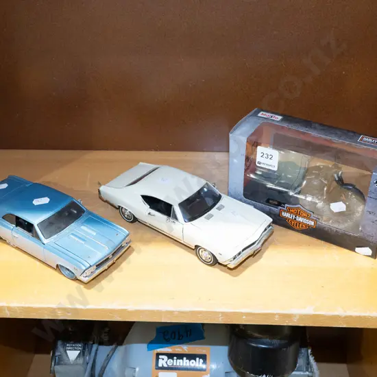 boxed Harley Davidson toy bike, 2x diecast cars