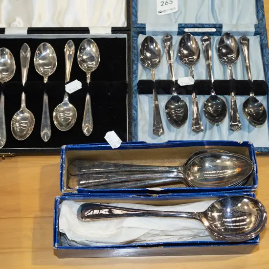 cased teaspoons and boxes of soup and dessert spoons