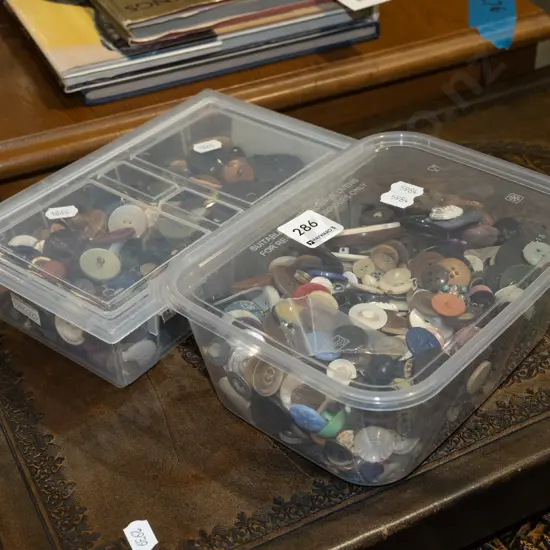 2x plastic containers of buttons