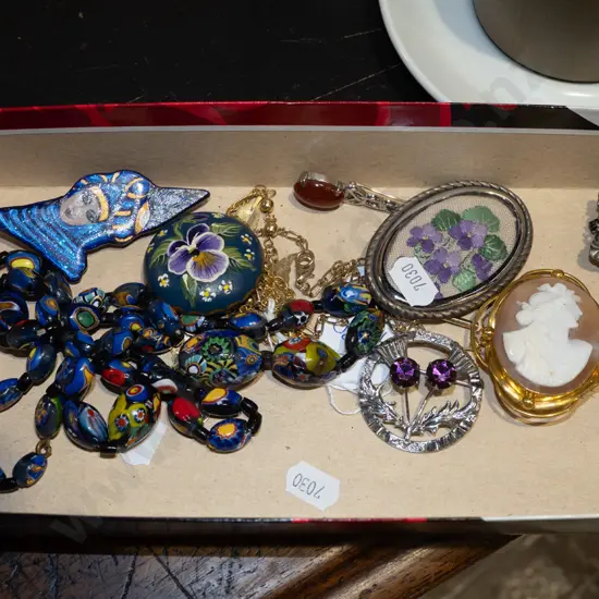 tray; brooches, beaded necklace