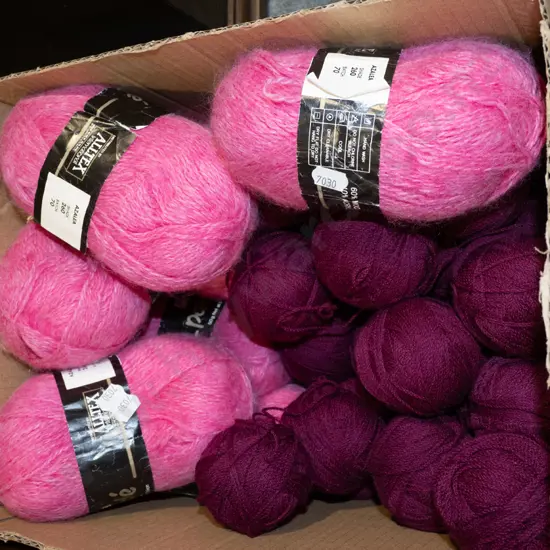 box; purple and pink knitting yarns