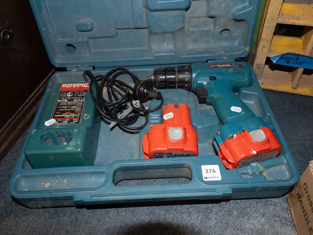 Makita battery powered drill, charger and case Image 1++