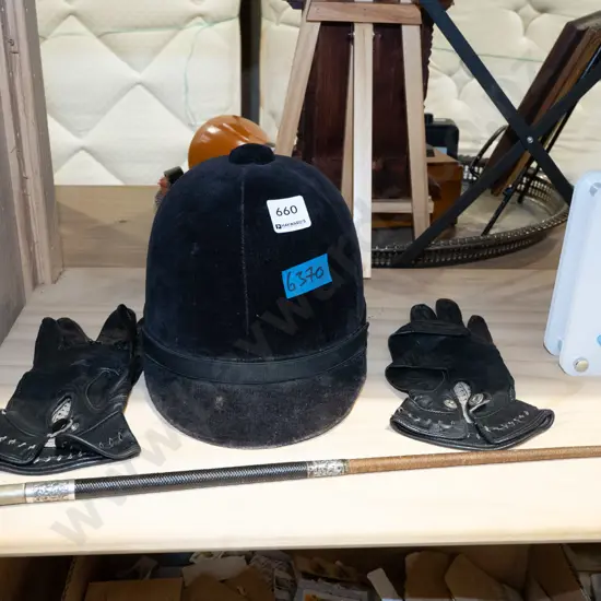 small equestrian helmet, gloves, riding crop