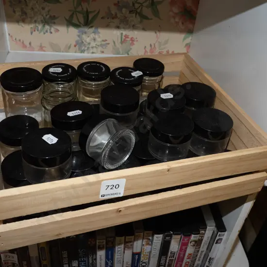 crate of lidded ointment jars
