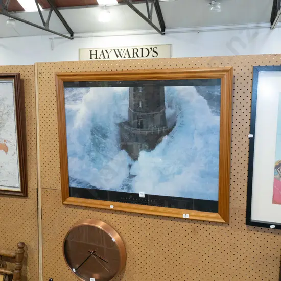 framed poster print - base of lighthouse in rough sea