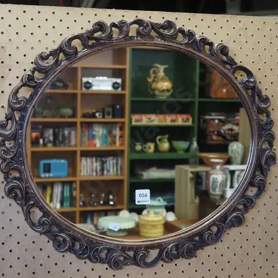 ornate oval framed wall mirror 