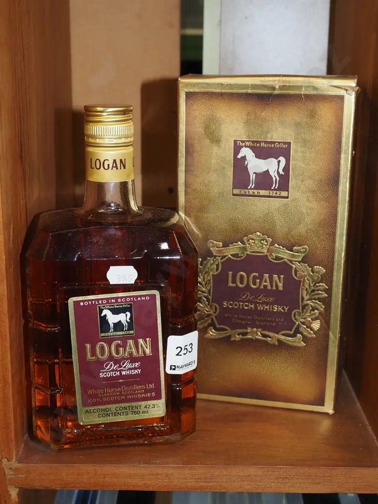 750ml bottle of Logan Delux Scotch Whisky Image 1++