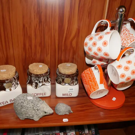 storage canisters, hedgehog figurines, coffee cups etc