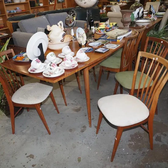 mid century Scandinavian style extending dining table with 8 matching chairs - some fading and