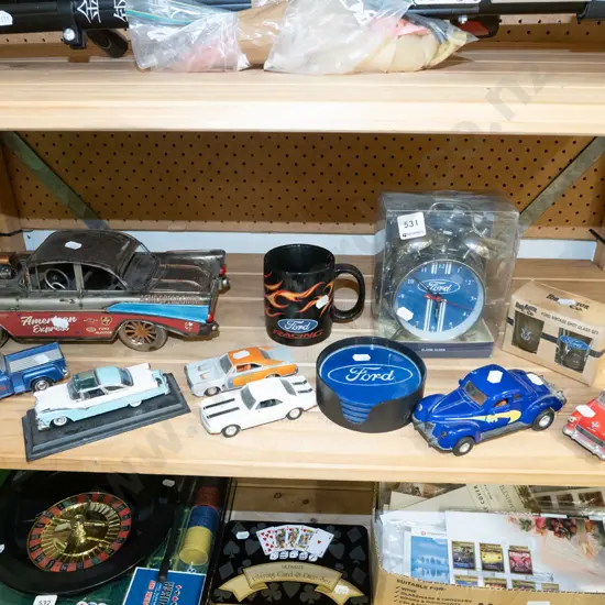 assorted model cars, Ford coasters, clock etc