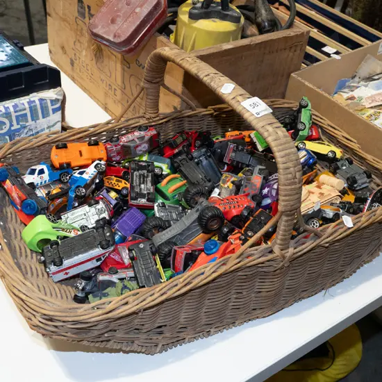 cane basket and toy vehicles