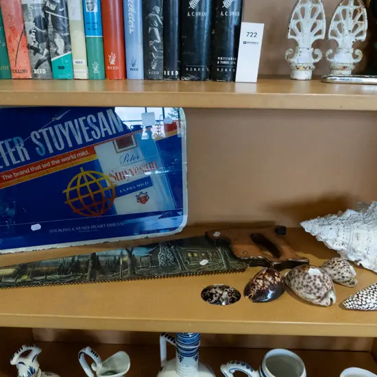  hand saw, cigarette ad behind glass, sea shells