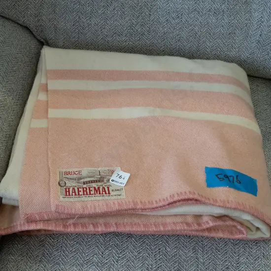 pink and white woollen blanket