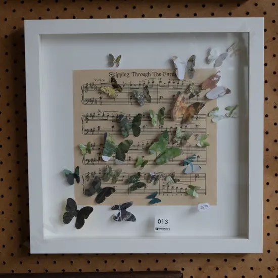 framed paper cut out butterflies and sheet music