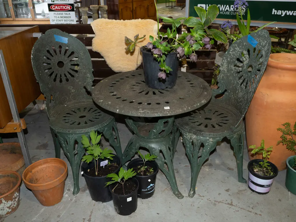green painted cast alloy outdoor table and 2 chairs Image 1++