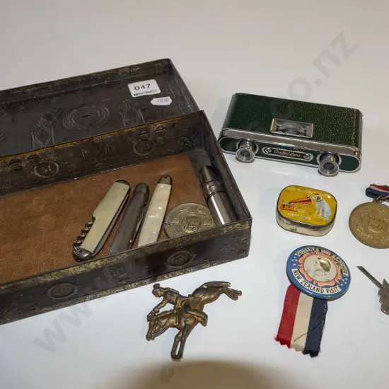 tin; opera glasses, pocket knife, badges etc