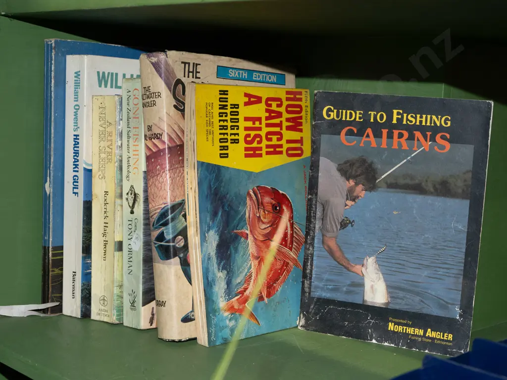 fishing books, tackle box and contents Image 1++