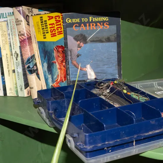 fishing books, tackle box and contents